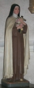 Statue sur piédestal : sainte Thérèse de l'Enfant-Jésus