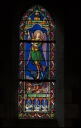 Ensemble des 14 verrières basses de la nef : saints Michel, Camille, Isidore, Coulomb, Méen, Convoyon, Malo, évêque, Cornely, Ange gardien, Baptême du Christ, Christ roi, Notre-Dame de Liège, Notre-Dame de Pontmain