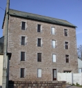 Ancienne minoterie du Verger, actuellement immeuble à logements, 10, 12 rue Grand'rue (Plurien)