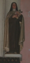 Statue dans une niche : sainte Thérèse de l'Enfant-Jésus